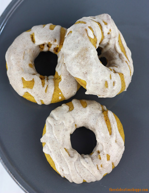 Pumpkin Donuts with Cinnamon Icing Drizzle | thecelebrationshoppe.com