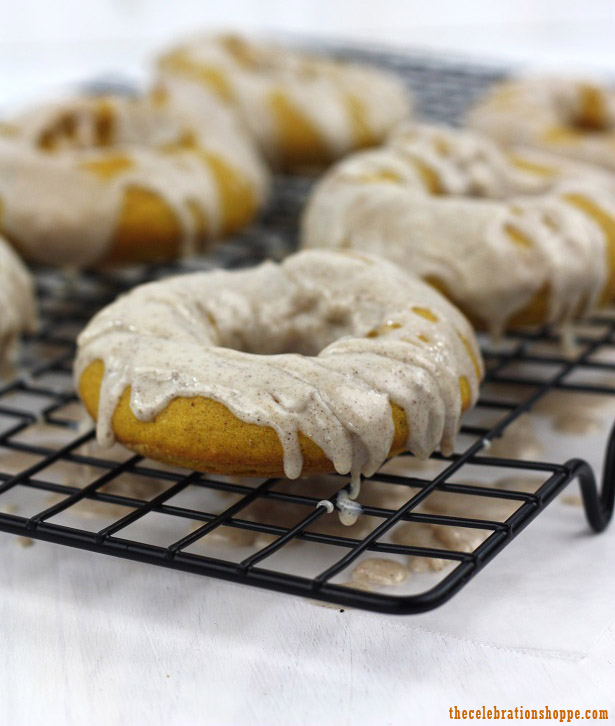 Pumpkin Donuts with Cinnamon Icing Drizzle | thecelebrationshoppe.com